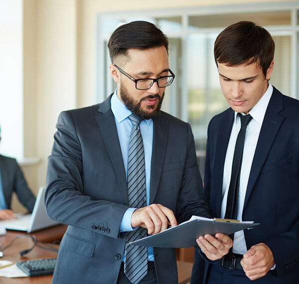 two man with discuss in blue jacket